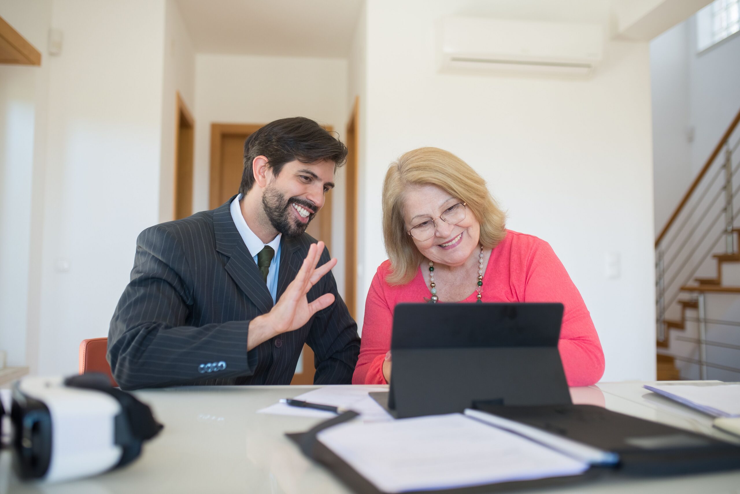 real estate agent reviewing transaction paperwork with a virtual assistant